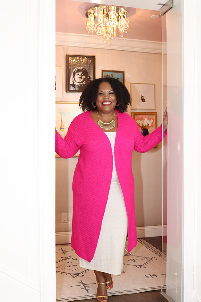 Professional woman in pink cardigan